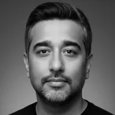 Sundeep Kumar, founder of Intellumia, in a black and white portrait.